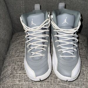 Gray and white Jordan 12’s
